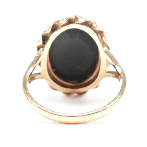 47 - A mid-century 9ct gold and onyx cabochon ring. Marked 9ct. Weight 4g. Size L.5. All weights, measure... 