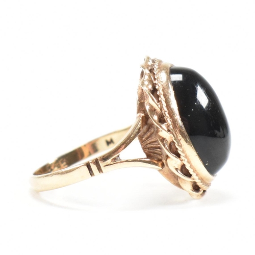 47 - A mid-century 9ct gold and onyx cabochon ring. Marked 9ct. Weight 4g. Size L.5. All weights, measure... 