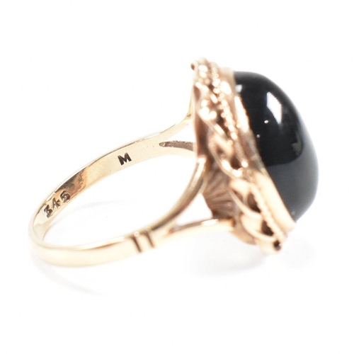 47 - A mid-century 9ct gold and onyx cabochon ring. Marked 9ct. Weight 4g. Size L.5. All weights, measure... 