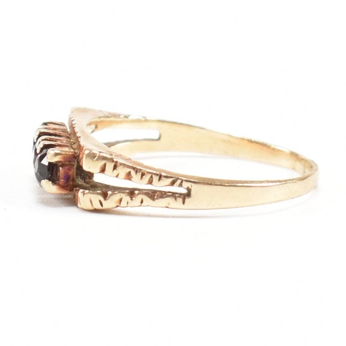 470 - A 1970s gold and garnet three stone ring. Partial marks for 9ct gold. Weight 2.4g. Size P. All weigh... 