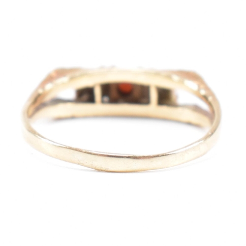 470 - A 1970s gold and garnet three stone ring. Partial marks for 9ct gold. Weight 2.4g. Size P. All weigh... 