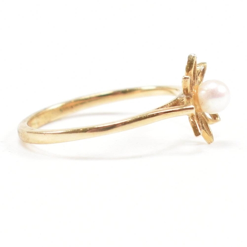 475 - A hallmarked 9ct gold and pearl flower ring. Weight 1g. Size I. All weights, measurements and sizes ... 