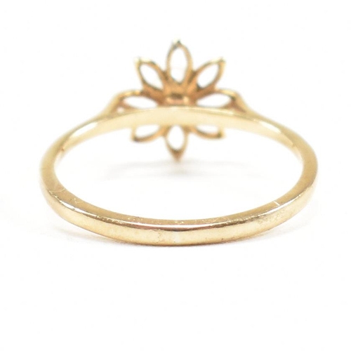 475 - A hallmarked 9ct gold and pearl flower ring. Weight 1g. Size I. All weights, measurements and sizes ... 