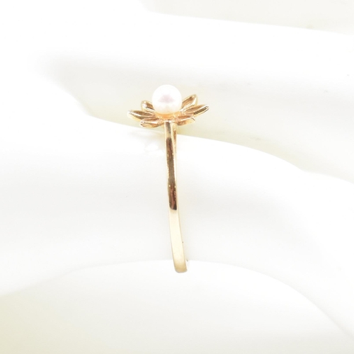 475 - A hallmarked 9ct gold and pearl flower ring. Weight 1g. Size I. All weights, measurements and sizes ... 