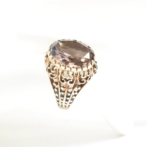 478 - A hallmarked 9ct gold and smoky quartz ring. Weight 5.4g. Size H. All weights, measurements and size... 