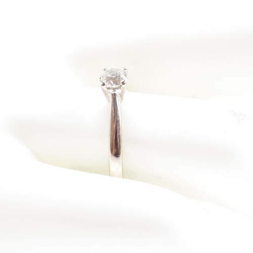 487 - A hallmarked 18ct gold and diamond solitaire ring. Estimated diamond weight 0.35ct. Weight 2.5g. Siz... 