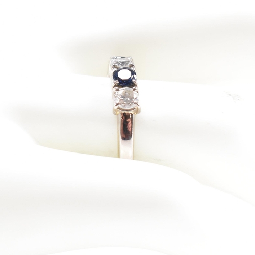 489 - An 18ct white gold sapphire and diamond five stone ring. Estimated total diamond weight 0.60ct. Esti... 