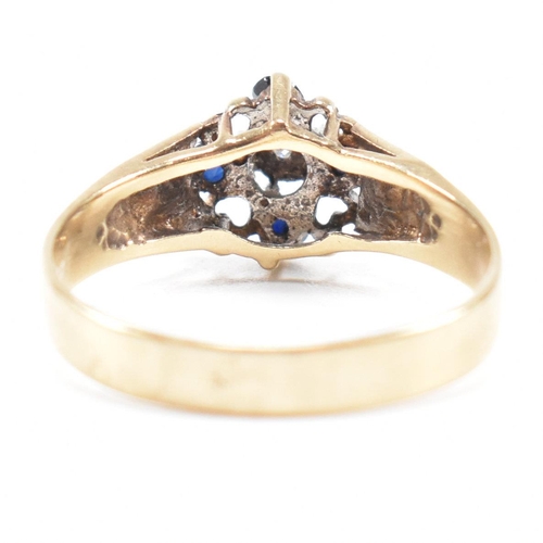 495 - A hallmarked 9ct gold sapphire and diamond cluster ring having heart decorated shoulders. Weight 2.8... 