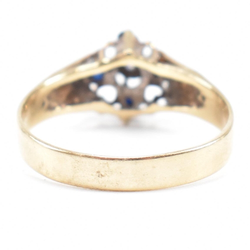 495 - A hallmarked 9ct gold sapphire and diamond cluster ring having heart decorated shoulders. Weight 2.8... 