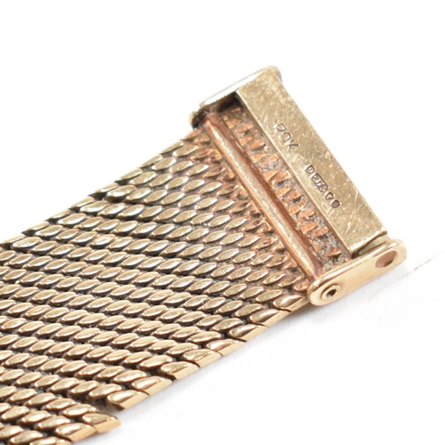 50 - A 1970s hallmarked 9ct gold mesh bracelet. The bracelet formed with textured bark style mesh links t... 