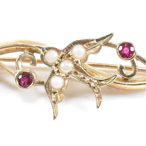 51 - A hallmarked 9ct gold ruby and pearl brooch pin with swallow motif. Weight 2.8g. Measures 3.8cm. All... 