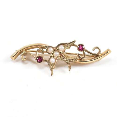 51 - A hallmarked 9ct gold ruby and pearl brooch pin with swallow motif. Weight 2.8g. Measures 3.8cm. All... 