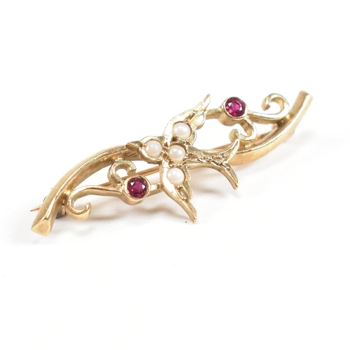 51 - A hallmarked 9ct gold ruby and pearl brooch pin with swallow motif. Weight 2.8g. Measures 3.8cm. All... 