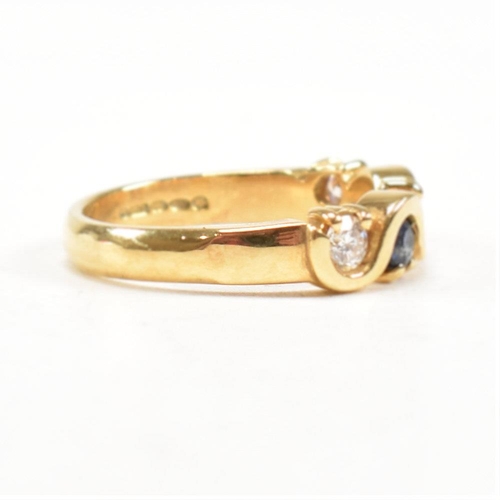 52 - A hallmarked 18ct gold sapphire and diamond five stone ring. The ring set with three round brilliant... 