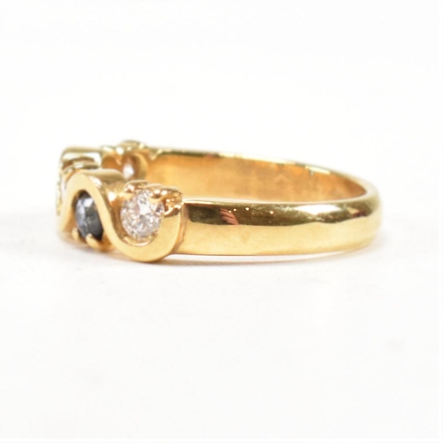 52 - A hallmarked 18ct gold sapphire and diamond five stone ring. The ring set with three round brilliant... 