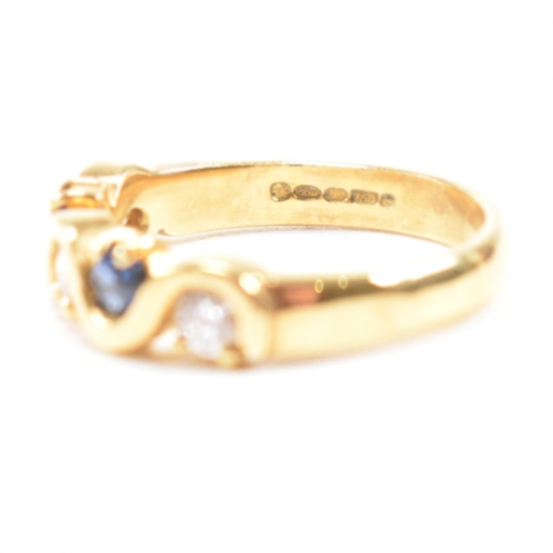 52 - A hallmarked 18ct gold sapphire and diamond five stone ring. The ring set with three round brilliant... 