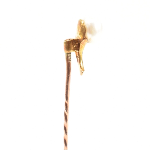 54 - A cased 19th century gold, pearl and turquoise stick pin in the form of a flower. Stamped 9ct to pin... 