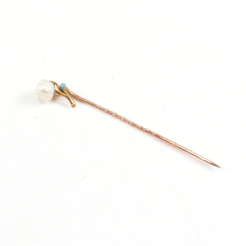 54 - A cased 19th century gold, pearl and turquoise stick pin in the form of a flower. Stamped 9ct to pin... 