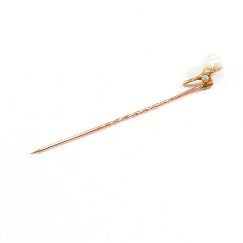 54 - A cased 19th century gold, pearl and turquoise stick pin in the form of a flower. Stamped 9ct to pin... 