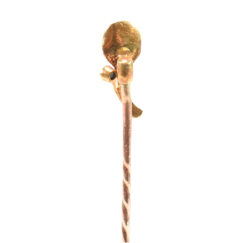 54 - A cased 19th century gold, pearl and turquoise stick pin in the form of a flower. Stamped 9ct to pin... 