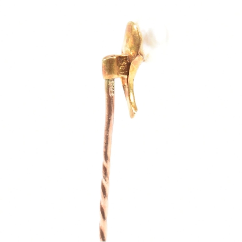 54 - A cased 19th century gold, pearl and turquoise stick pin in the form of a flower. Stamped 9ct to pin... 