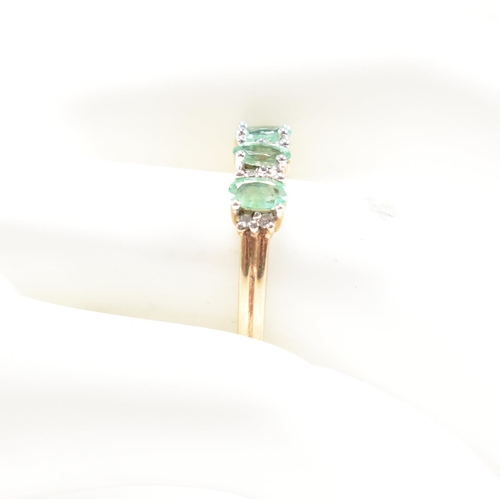 55 - A hallmarked 9ct gold emerald and diamond half hoop ring.  Weight 2.7g. Size M.5. All weights, measu... 