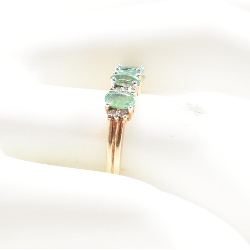 55 - A hallmarked 9ct gold emerald and diamond half hoop ring.  Weight 2.7g. Size M.5. All weights, measu... 