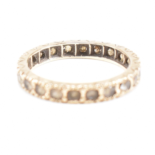 56 - Two hallmarked 9ct gold gem set rings. A hallmarked 9ct gold eternity ring set with white stones tog... 