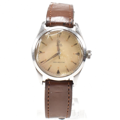 58 - A Mid century Tudor Oyster wristwatch. Stainless steel case with champagne dial, baton and diamond s... 