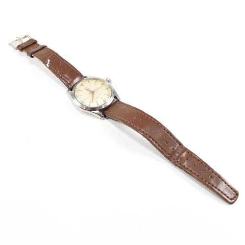 58 - A Mid century Tudor Oyster wristwatch. Stainless steel case with champagne dial, baton and diamond s... 