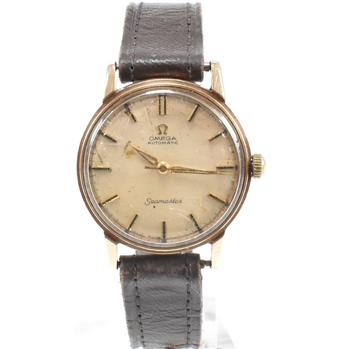 6 - A 9ct gold Omega Automatic Seamaster wristwatch. The watch with baton numerals having dagger hands. ... 