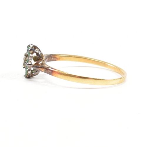 69 - A hallmarked 18ct gold emerald and diamond cluster ring. The ring hallmarked London. Weight 2.9g. Si... 