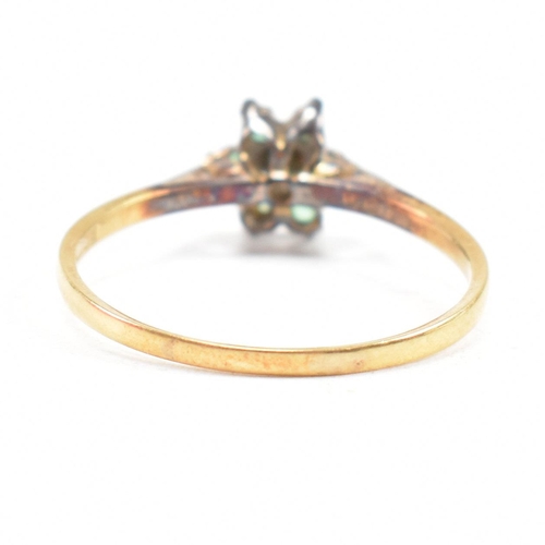 69 - A hallmarked 18ct gold emerald and diamond cluster ring. The ring hallmarked London. Weight 2.9g. Si... 