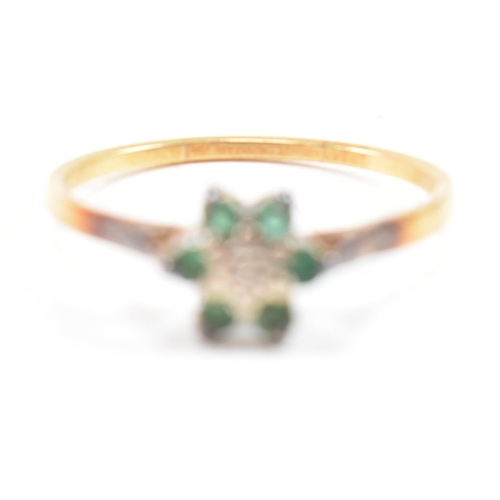 69 - A hallmarked 18ct gold emerald and diamond cluster ring. The ring hallmarked London. Weight 2.9g. Si... 