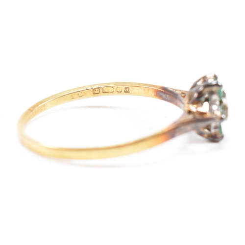 69 - A hallmarked 18ct gold emerald and diamond cluster ring. The ring hallmarked London. Weight 2.9g. Si... 