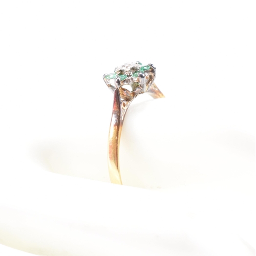 69 - A hallmarked 18ct gold emerald and diamond cluster ring. The ring hallmarked London. Weight 2.9g. Si... 