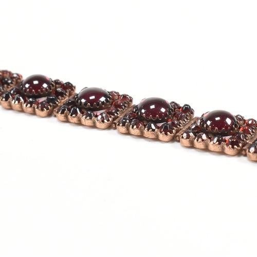 7 - A Victorian 19th century bohemian garnet gilt metal panel bracelet. The bracelet formed with 12 pane... 