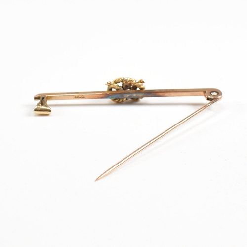 73 - A 1920s 9ct gold and ruby knot bar brooch pin. Marked 9ct. Weight 3.2g. Measures 5cm. All weights, m... 