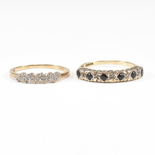 75 - Two hallmarked 9ct gold half hoop rings. A diamond set half hoop ring with star decoration and a sap... 