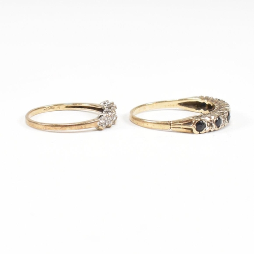 75 - Two hallmarked 9ct gold half hoop rings. A diamond set half hoop ring with star decoration and a sap... 