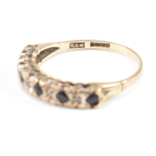 75 - Two hallmarked 9ct gold half hoop rings. A diamond set half hoop ring with star decoration and a sap... 