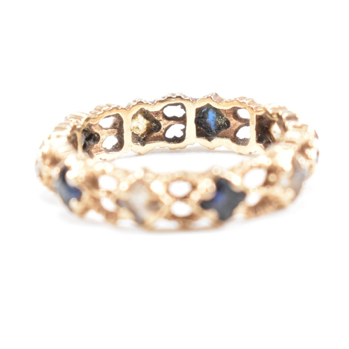 82 - A mid century gold sapphire and spinel eternity ring. Weight 2g. Unmarked tests indicate gold. Size ... 