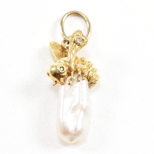 85 - A hallmarked 14ct gold and pearl necklace pendant. The pendant formed of a baroque Keshi pearl surmo... 