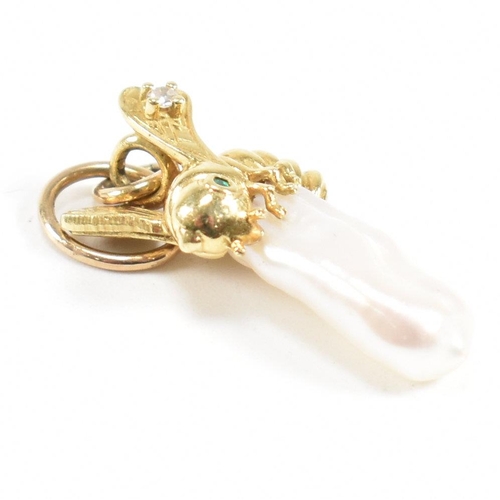 85 - A hallmarked 14ct gold and pearl necklace pendant. The pendant formed of a baroque Keshi pearl surmo... 