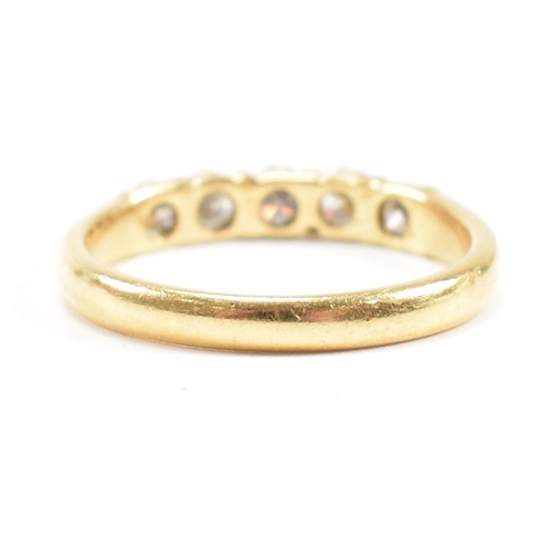 90 - An 18ct gold and diamond five stone ring. Estimated total diamond weight 0.60ct. Size M.5. Weight 2.... 