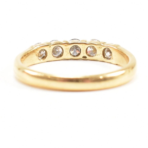 90 - An 18ct gold and diamond five stone ring. Estimated total diamond weight 0.60ct. Size M.5. Weight 2.... 