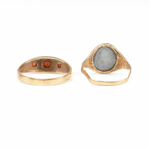 91 - Two 9ct gold rings. A hallmarked garnet set three stone ring and hematite signet ring. Weight 5.2g. ... 