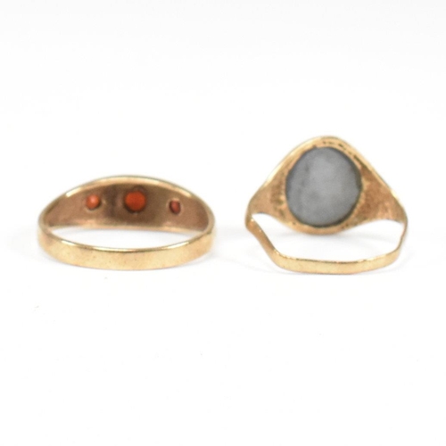 91 - Two 9ct gold rings. A hallmarked garnet set three stone ring and hematite signet ring. Weight 5.2g. ... 