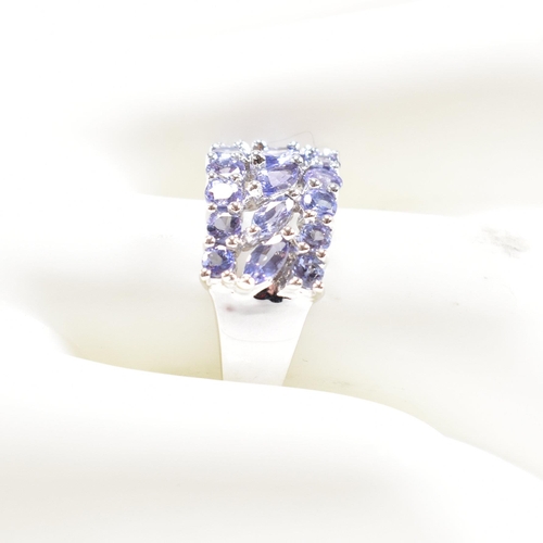 93 - A hallmarked 9ct gold and tanzanite cluster ring. Weight 3.4g. Size O. All weights, measurements and... 