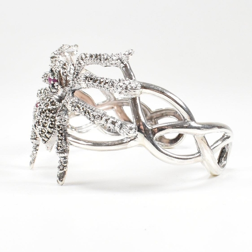 94 - A contemporary 925 silver marcasite and ruby spider cuff bangle. Stamped 925. Weight approx 38.3g. M... 